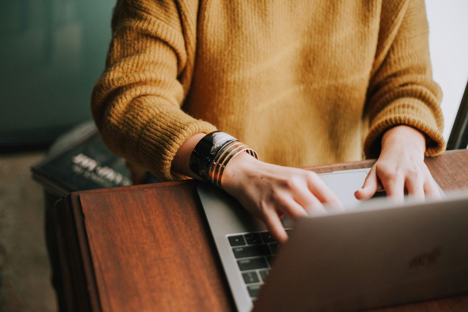 Brand owner working on a laptop planning a direct to consumer website migration